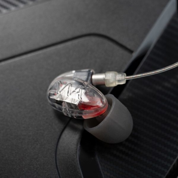 A close-up image of a single Westone Audio Pro-X10 in-ear monitor (IEM) with a clear cable inserted.