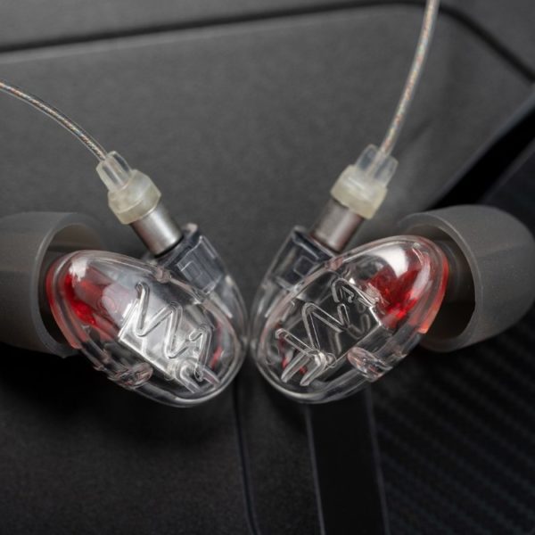 A pair of Westone Audio Pro-X10 in-ear monitors (IEMs) with clear cables inserted.
