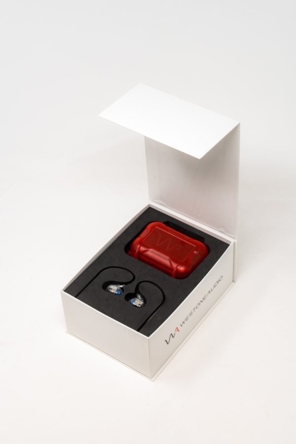 A photo of a Westone Audio Pro-X20 in-ear monitor (IEM) in a white box with a red case and the IEMs.